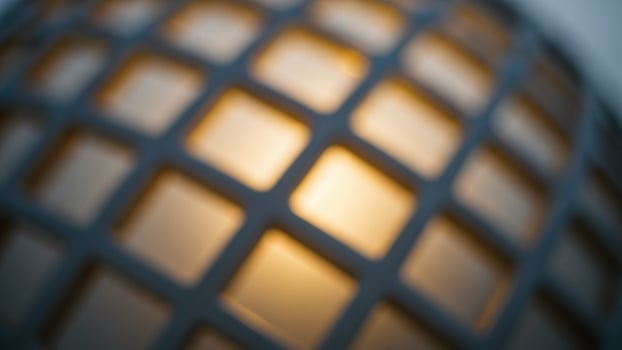 A close up of a light bulb with a grid pattern photo