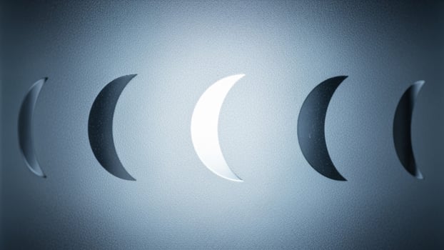 A photo of a moon with four different phases