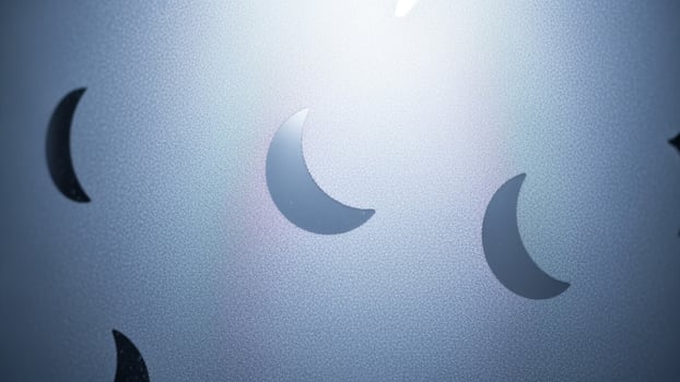 A close up of a metal wall with a moon on it photo