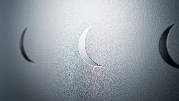 A close up of three crescents on a wall photo
