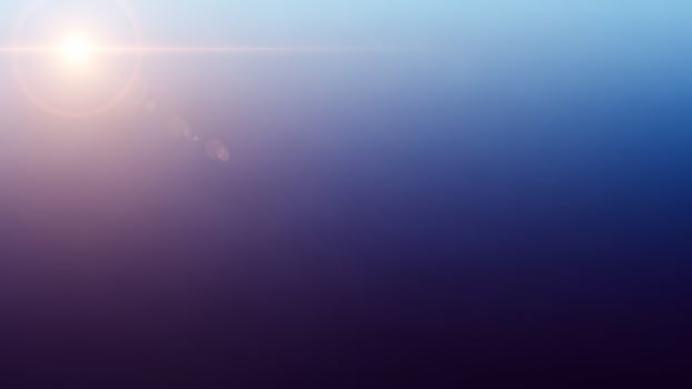 Sunlight shining through a blue and purple haze photo