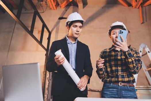 Young construction team discussing plans photo