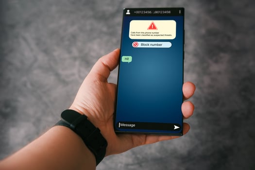 Text message scammer concept. Woman receives suspicious message on phone. Fraud and phishing phone concept. Message from stranger. photo