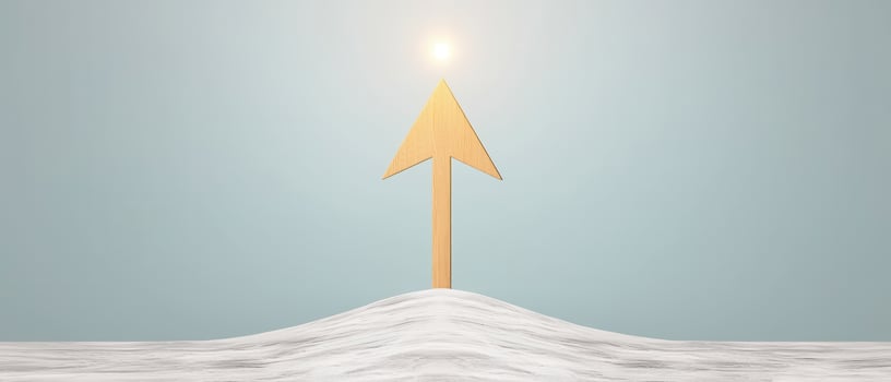Wooden arrow symbol on white surface with bright sky background inspiring motivation and growth photo