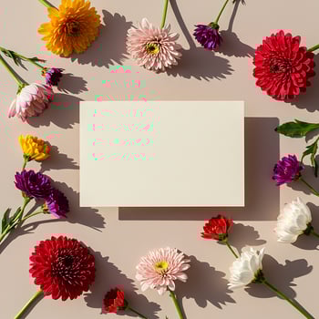 Flowers and blank card on a light pink background photo