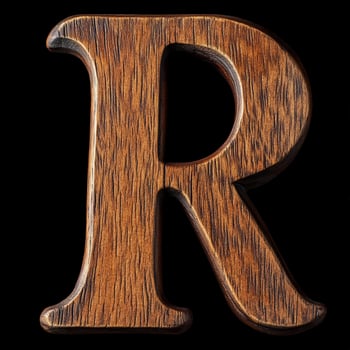 Beautiful wooden letter R showcases natural grain and texture details against a black backdrop photo