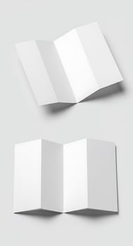 Two folded white paper brochures on a white background photo