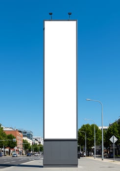 Blank billboard mockup on the street with blue sky background photo