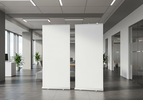 Two large roll up banners in an office photo