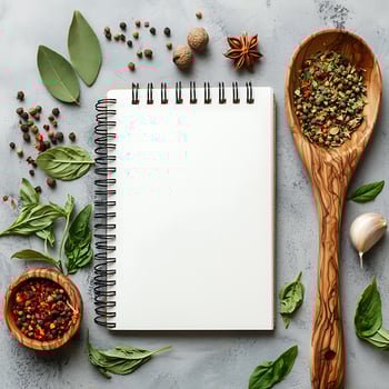 Blank Recipe Notebook with Herbs, Spices, and Kitchen Tools on Rustic Surface photo