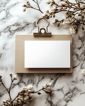 Mockup of Blank Card on Clipboard with Floral Background photo