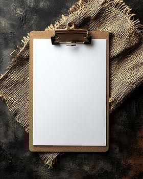Blank Clipboard with White Paper on Artistic Textured Background photo