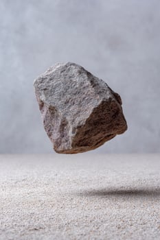 Floating ethereal stone levitates above desert sands, hinting at Anti Gravity Day and Rock Balancing Festival mysteries photo