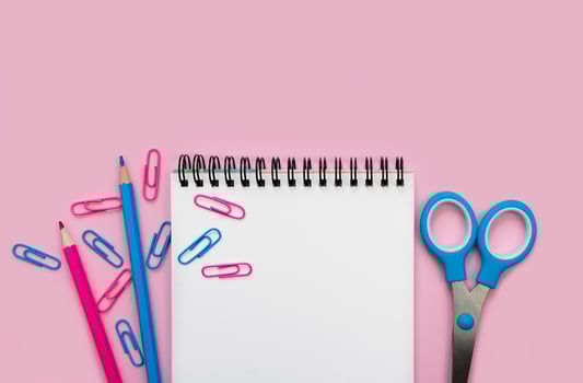 Stationery and notebook on the pink background. Mockup. Back to school. Flatlay. Top view. Copy space. photo
