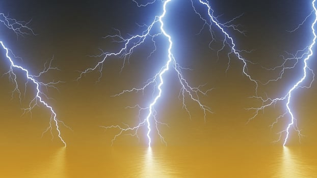 Three lightning strikes are shown over water photo