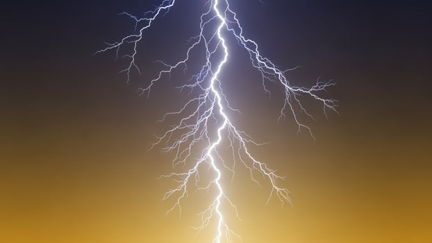 Lightning bolt striking the sky at sunset photo