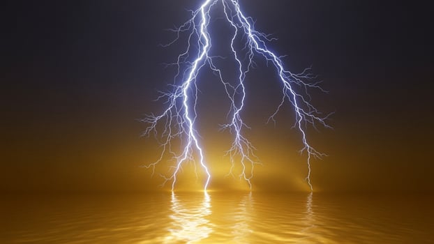 Lightning strike over water photo