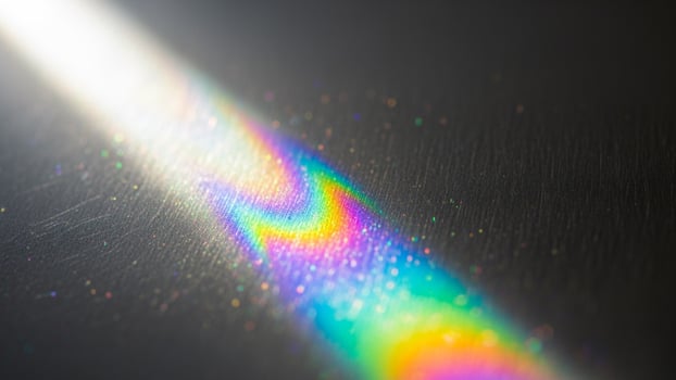 A rainbow light shining through a window photo