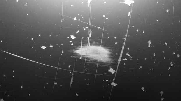 A black and white photo of a broken window