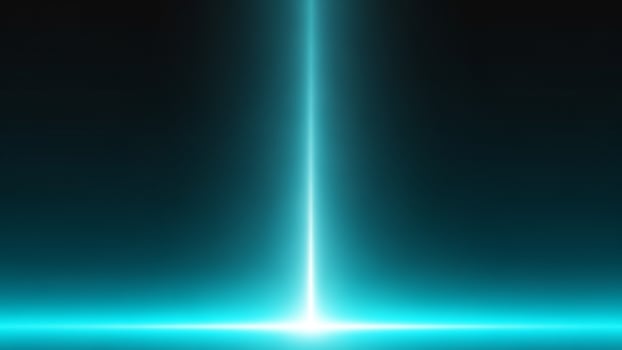 A glowing blue light is shining on a dark background photo