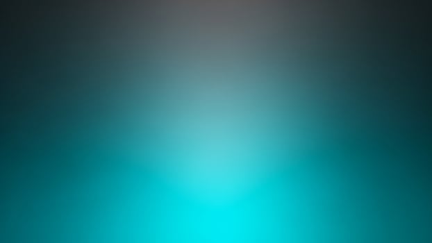 A blue and green light is shining on a black background photo