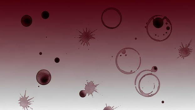 A red and white background with many different colored spots photo