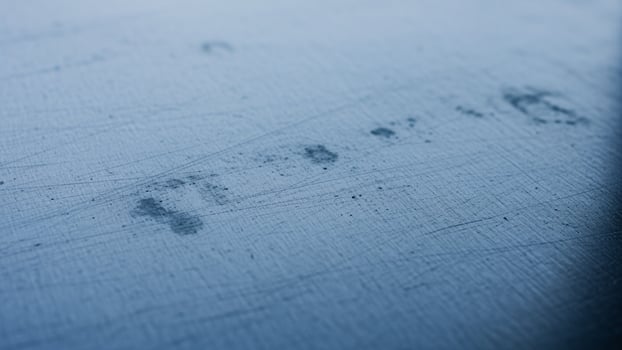 A metal surface with a blue background photo