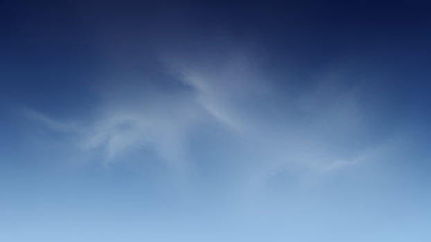 A plane flying in the sky with a blue sky photo