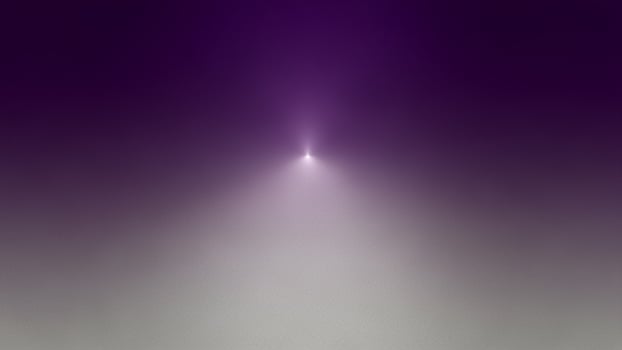 A purple light is shining through the fog photo