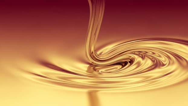 Golden liquid swirls on a brown background photo