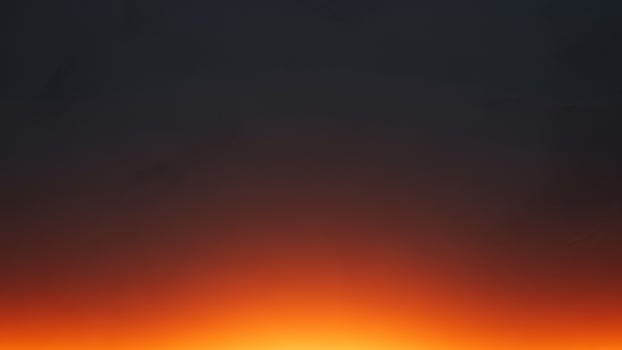 A dark background with orange and black photo