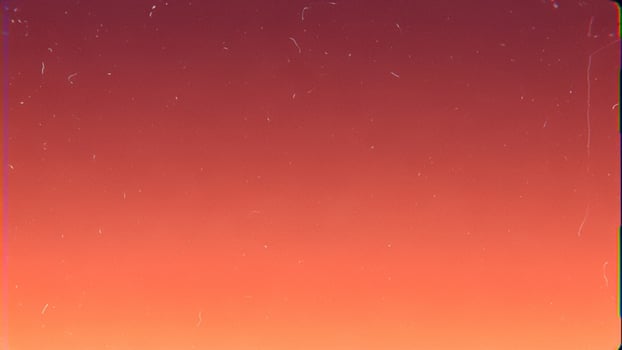 A red and orange sky with a few clouds photo
