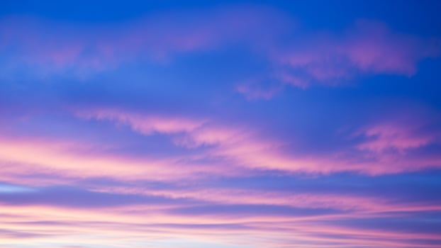 A blue sky with pink clouds and a blue sky photo
