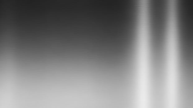 A black and white image of a metal surface photo