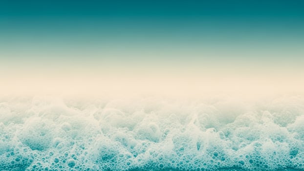 A blue ocean with waves and a sky photo