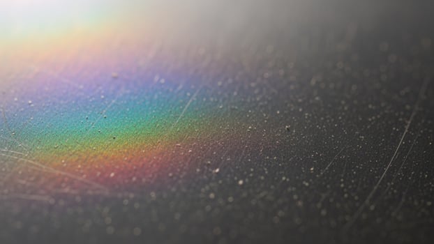 Rainbow light on a metal surface photo