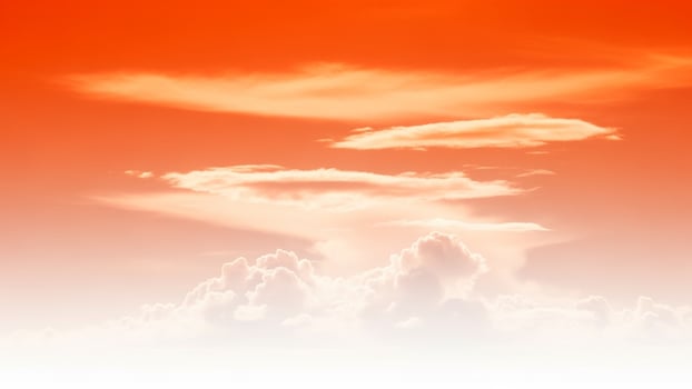 A beautiful orange sky with clouds and a few clouds photo