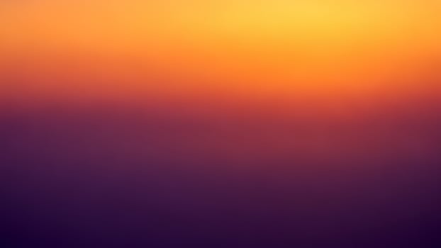 A blurry image of a sunset with orange and purple colors photo