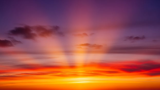 A beautiful sunset with bright sun rays photo