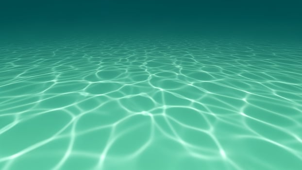 A green ocean surface with ripples and light photo