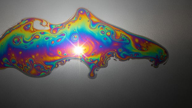 A colorful liquid on a surface photo