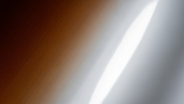 A white and brown background with a silver object photo