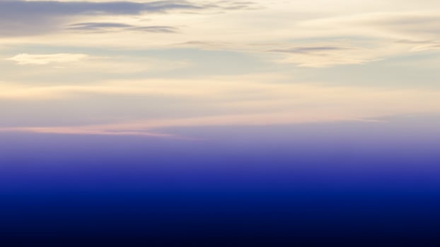 A plane flying over the ocean with clouds in the sky photo