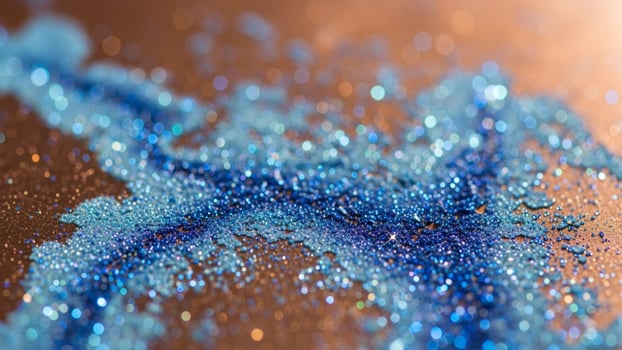 Blue glitter on a brown surface photo
