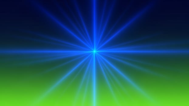 A blue and green light beam on a green background photo