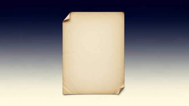 An old piece of paper on a blue background photo