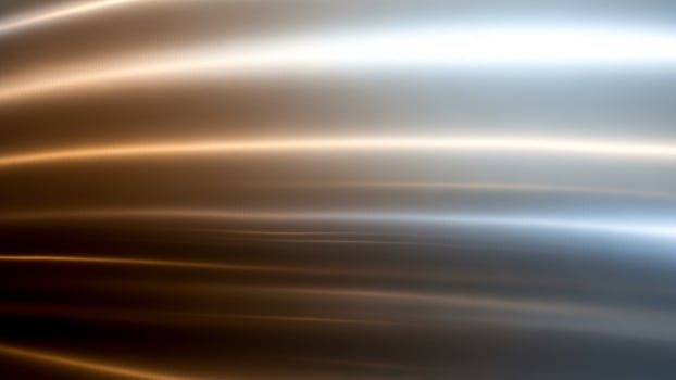 A shiny metal background with a wave pattern photo