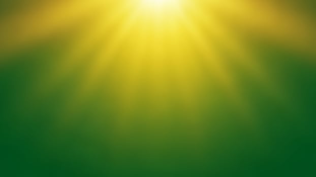 A bright yellow sun shining over a green background photo