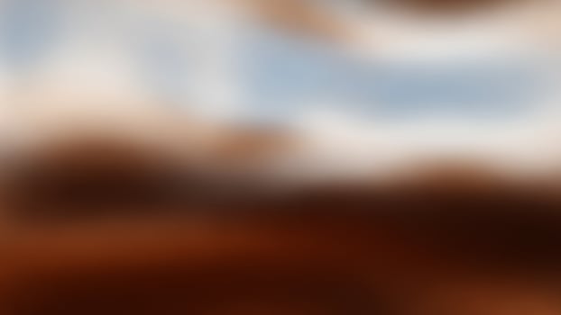 A blurry image of a brown and white building photo