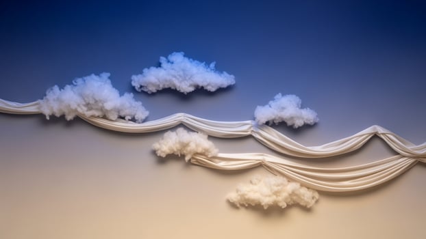 Clouds and fabric on a wall with a blue sky photo